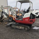 video of putting tracks on a mini excavator